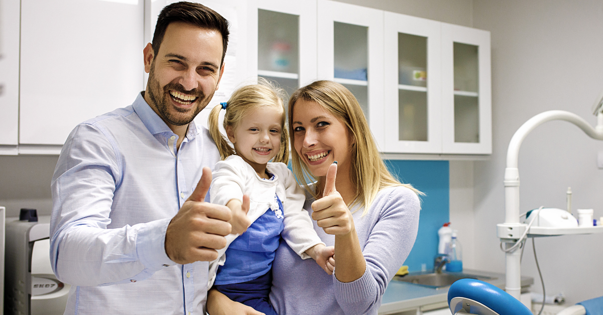 Family receiving dental care at Apple Wellness Dental in Airdrie, Alberta.