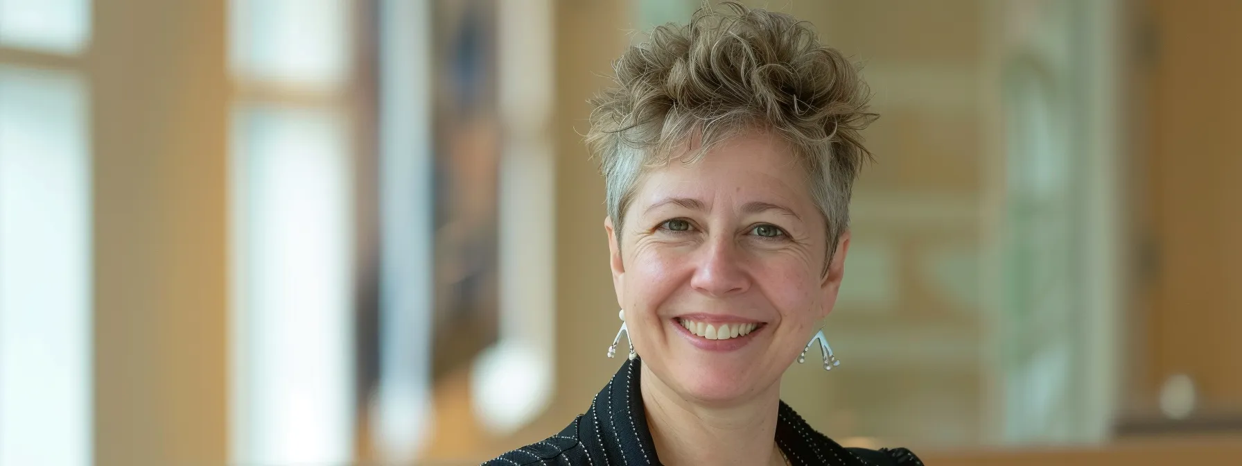 a person smiling with confidence, showcasing a gleaming set of dental implants in airdrie.